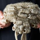 Why do barristers wear wigs and gowns?