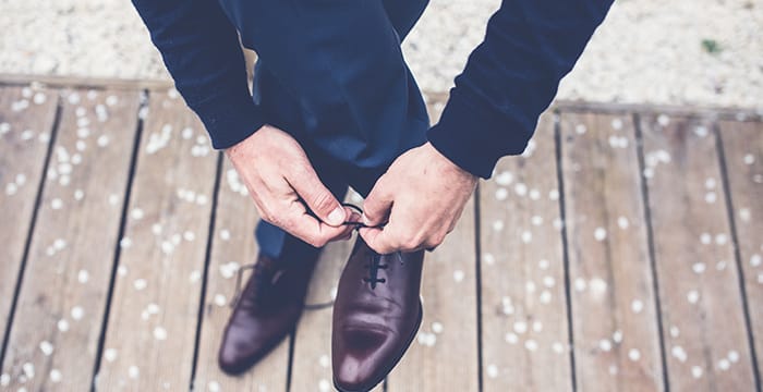 blue blazer and brown shoes