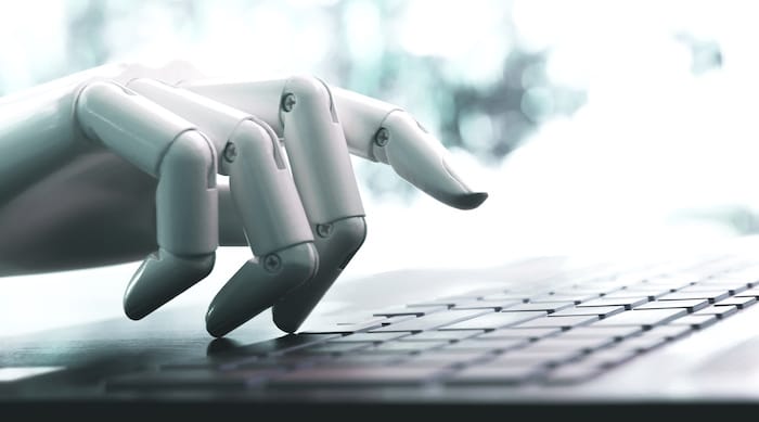 Robot hand using laptop